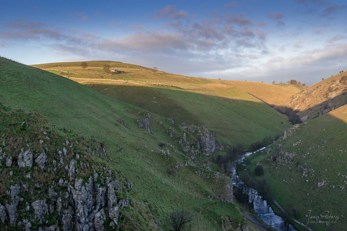 The sun hitting the top of Gratton Hill with Peaseland Rocks in the foreground.