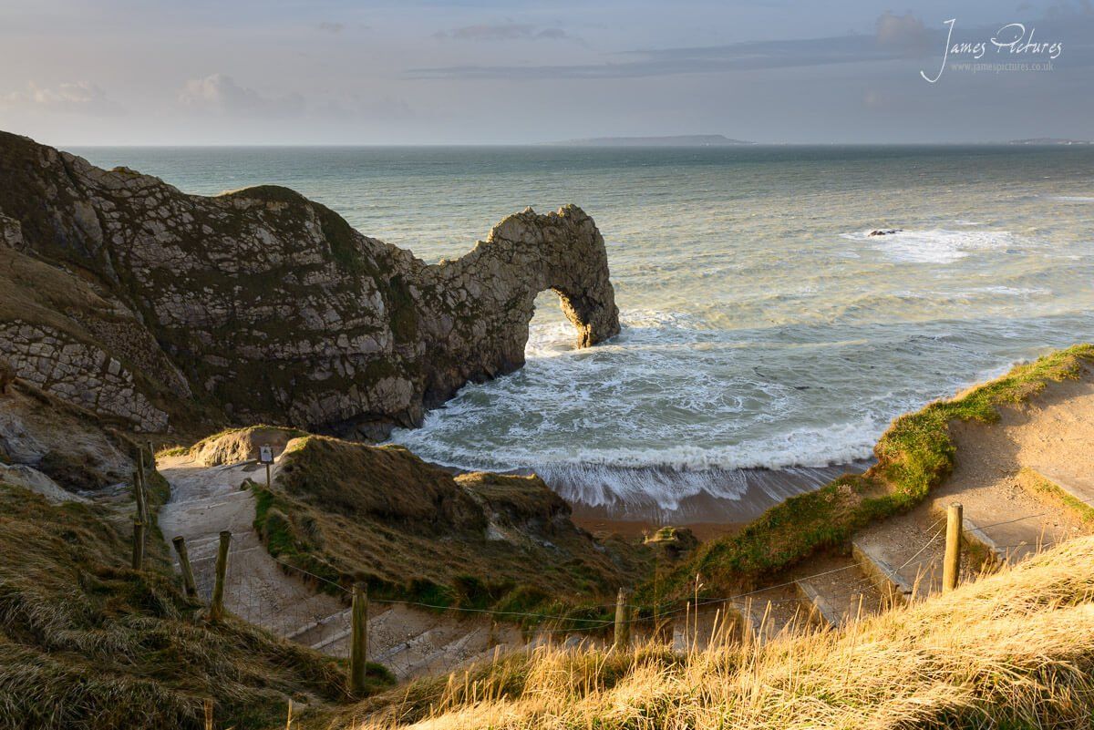 Durdle Door on the amazing Jurassic Coast as the sun rises behind me