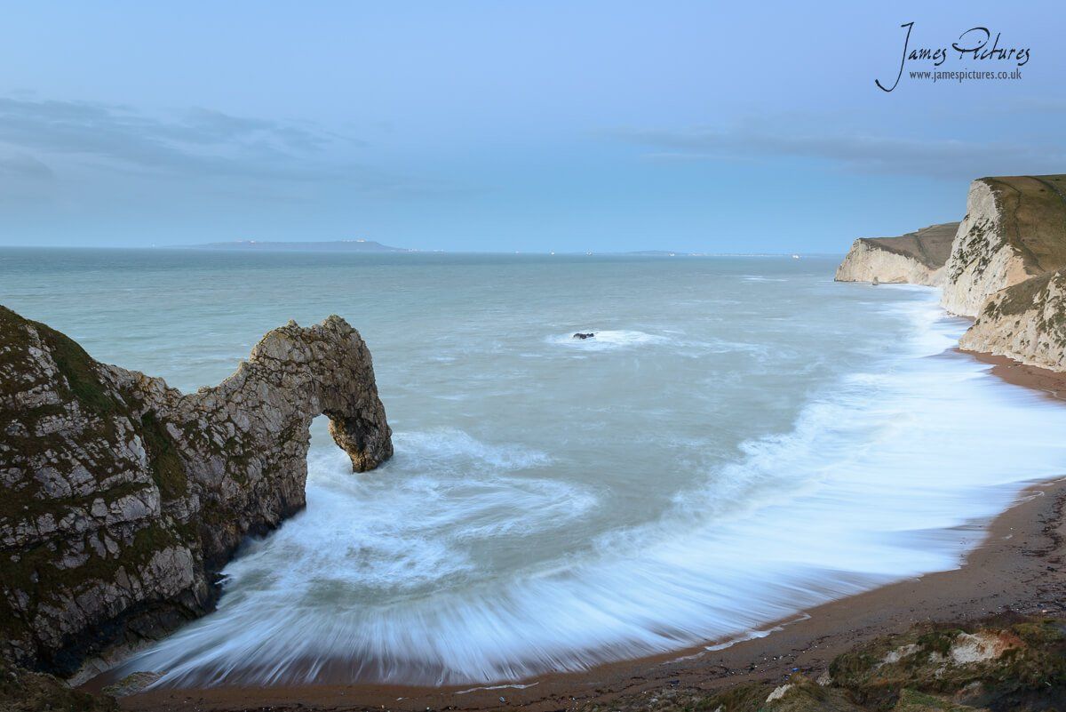 Pre sunrise on the Jurassic Coast with Durdle Door in the foreground.