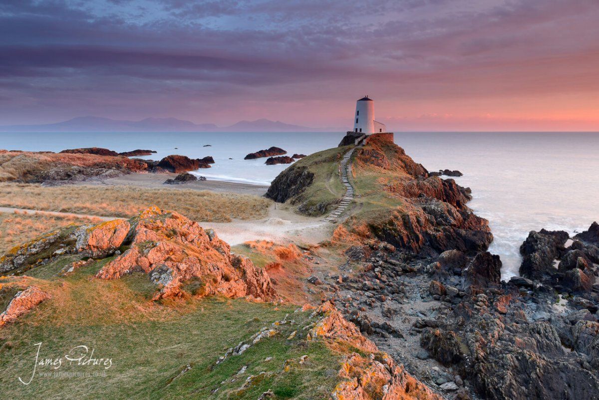 The stunning Llanddwyn Island Lighthouse at sunset. Llanddwyn Island is one of those places that you must visit if coming to wales, its views are speechless and breathtaking.