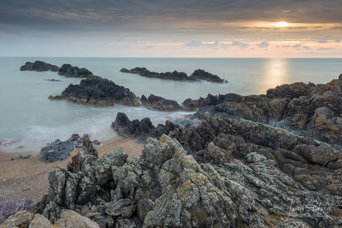 The setting sun over Llanddwyn Island