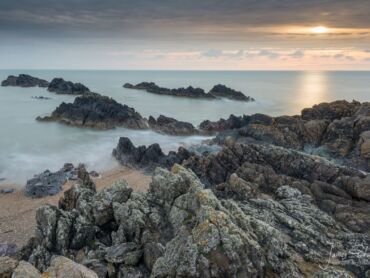 The setting sun over Llanddwyn Island