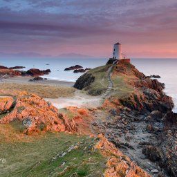 The stunning Llanddwyn Island Lighthouse at sunset. Llanddwyn Island is one of those places that you must visit if coming to wales, its views are speechless and breathtaking.
